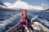 Sami reindeer herder, Aslak, takes his boat to summer pastures on an island. North Norway. 1985