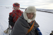 Saami reindeer herder, Nils Peder Gaup, and his wife Inge Ellen, out checking their reindeer on a snowmobile. Kautokeino, Finnmark, North Norway. 2007