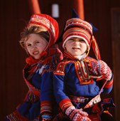 Sami boy and girl in traditional clothing. Kautokeino. Norway. 1972