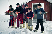 Inuit pupils brushing their teeth outside the school in the village of Siorapaluk. Robertson Fiord, Thule, Northwest Greenland. (1977)
