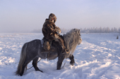 A Yakut horse herder riding in the winter time near Verkhoyansk. Yakutia, Siberia, Russia. 1999