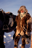 A Yakut horse herder dressed in traditional horse skin clothing in the winter time near Verkhoyansk. Yakutia, Siberia, Russia. 1999