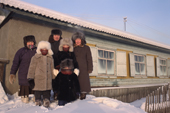 The Potapova family pose outside their home in Verkhoyansk. Yakutia, Siberia. Russia. 1999