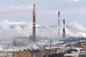 Smoke containing sulphur dioxide belches from the chimneys of a nickel foundry at Norilsk W.Siberia, Russia. 2000