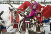 Yulena Serotetto, a Nenets woman, and her daughter, Marina, dressed up in traditional reindeer skin clothing for a Spring reindeer herders' festival. Yamal, NW Siberia, Russia