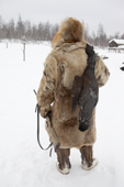 Kosta, a Selkup man, returns to a winter camp after hunting Capercaille. Krasnoselkup, Yamal, Western Siberia, Russia. (2012)