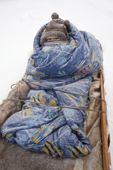 Albina, a young Selkup girl, warmly wrapped up for a winter sled journey near Ratta. Krasnoselkup, Yamal, Western Siberia, Russia. (2012)