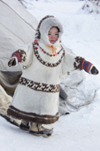3 year old Khanty girl, Angelina Ozelova playing outside at a Khanty reindeer herder's winter camp. Shuryshkarsky Region, Yamal, NW Siberia, Russia