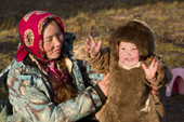 Mariana Nyerkungy, a young Nenets woman, with her 14 month old son, Savely, at a reindeer herders' camp, Yamal Peninsula, NW Siberia, Russia