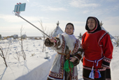 Dressed in traditional Nenets reindeer skin clothing, Neseynya Serotetto, takes a Selfie of herself with Tyurko Puyko at Yar-sale, Yamal, NW Siberia, Russia