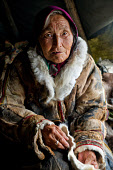 Portrait of Nitu, an elderly Nenets woman, at a fishing camp on the River Taz. Tazovsky Region, Yamal, NW Siberia, Russia